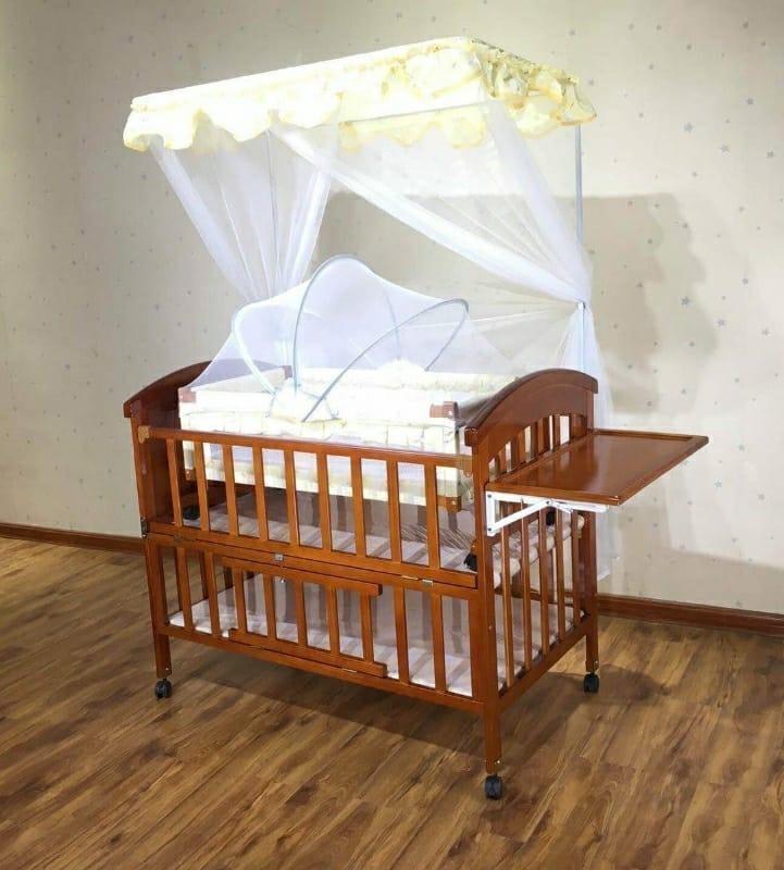 baby wooden cot with swing and mosquito net